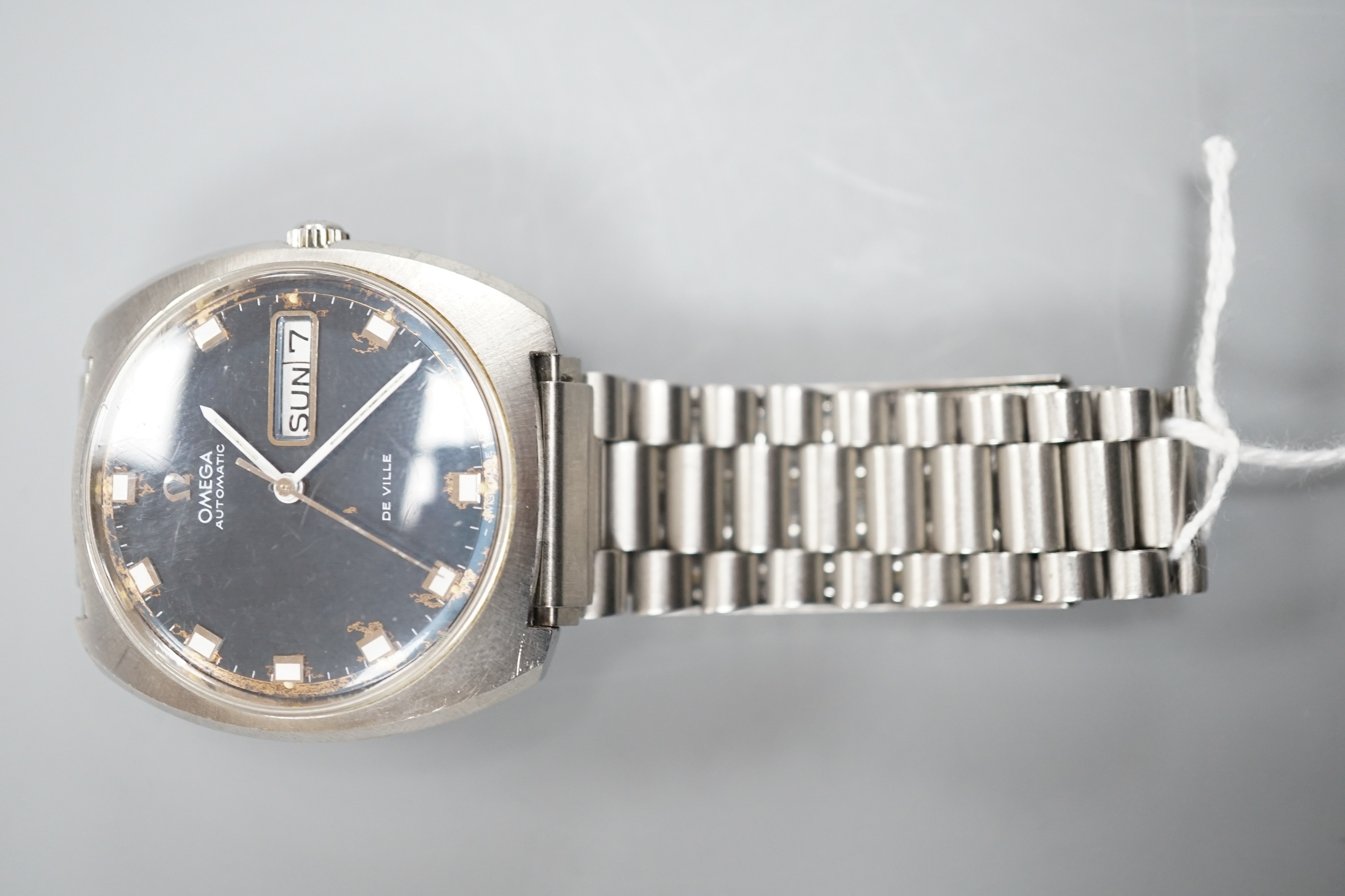 A gentleman's 1960's? stainless steel Omega De Ville automatic day date wrist watch, on associated steel bracelet, case diameter 36mm, no box or papers (dial a.f.).